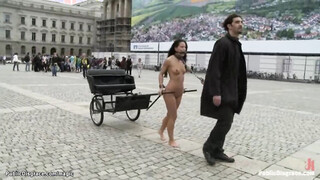 Naked babe pulling charios in public