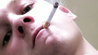 Twink savors the pleasure of smoking & stroking meat