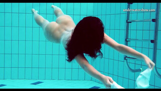 Hot babe in the pool naked & horny big tits