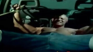 Muscle jock tied up with heavy rope during outdoor BDSM