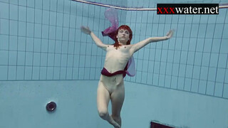 Smoking sexy Russian redhead Ala in the pool