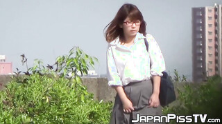 Japanese lady finds a secluded place to pee in public space
