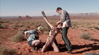 Deviant couple torment babe in desert