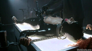 Shackled black in latex beaver vibed