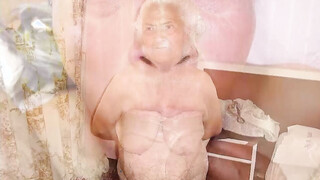Old Woman squeezes her giant breasts with big nipples