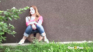 Ladies outside in public looking hot peeing