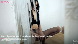 Hot babe jerks off her strapless cock until it squirts cum