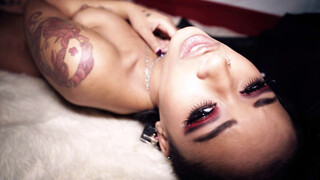 The queen of the night is covered in leather like Venus in furs