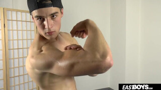 Handsome muscle boy shows his hard abs