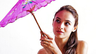 Fedra toying her beaver with a purple parasol