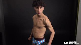 Curly twink boy shows off his slim body on webcam
