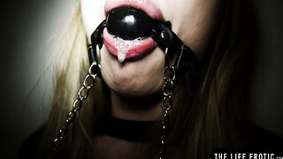 Ballgagged blonde Lucy Heart rams her butt with a glass dilco