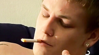 Tomy cant help rubbing his throbbing prick while smoking