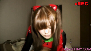 Japanese teen in costume riding on a large pecker