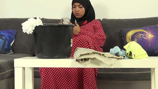Unshaved female in hijab doing extra cleaning