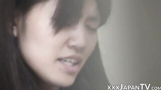Nasty Japanese teenie shaves legs & fingers cunt