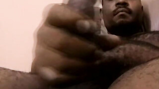 Mature black amateur strokes his big black cock solo & cums