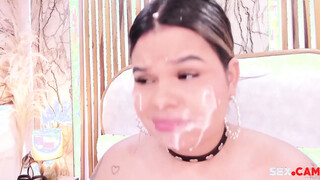 chubby babe with fake cum on her face sucks a big dildo