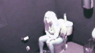 Sexy Blonde fingering her cunt public toilet