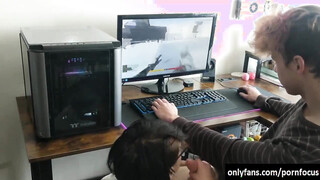 Horny babe sucking boyfriends shaft while he is playing a game