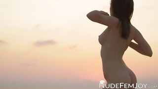 Sexy brunette spreads wide her silky legs to reveal her tasty twat