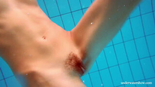 Marusia shows you her bushy sweet vagina in the pool