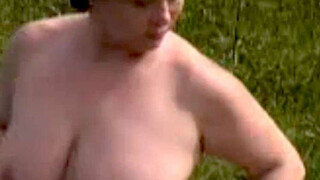 A sexy fatty masturbates outdoors