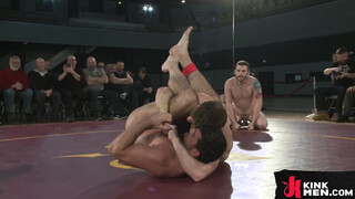 Muscular wrestlers can't handle each other during the round