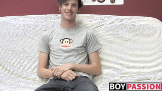 Charming gay guy Danny jerks off his shaft on couch solo