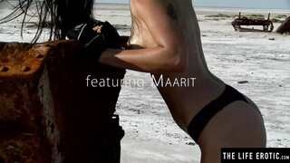 Splendid brunette Maarit is masturbating outdoors