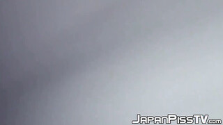 Delectable Japanese babe is peeing outside during day time