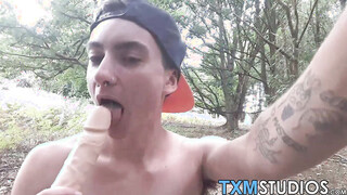Young FTM shaft rider shoves a dildo in his hole outdoors
