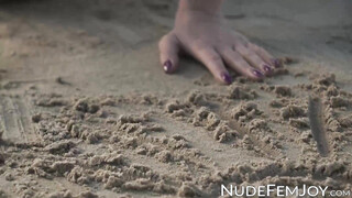 Perfect goddess like Natalie E having fun teasing herself in the white sand