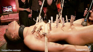 Ebony slave holding heavy padlocks