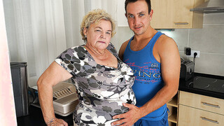 Buxom gilf sucking & fucking a way younger dude in her kitchen