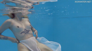 Finnish babe swims nude in the pool