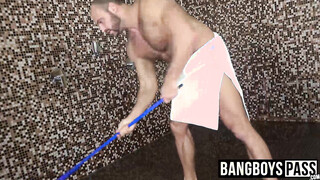 Man with muscles is stroking his giant meat under the shower