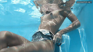 Fun Hungarian babe Zazie Skymm swims naked & horny